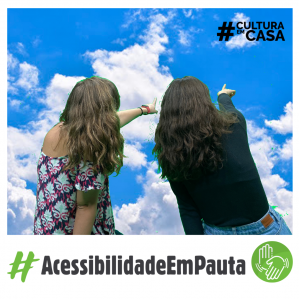 Duas mulheres de costas apontando para o céu