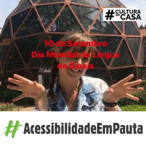 Mulher com mãos abertas e ao fundo um domo de aço vermelho